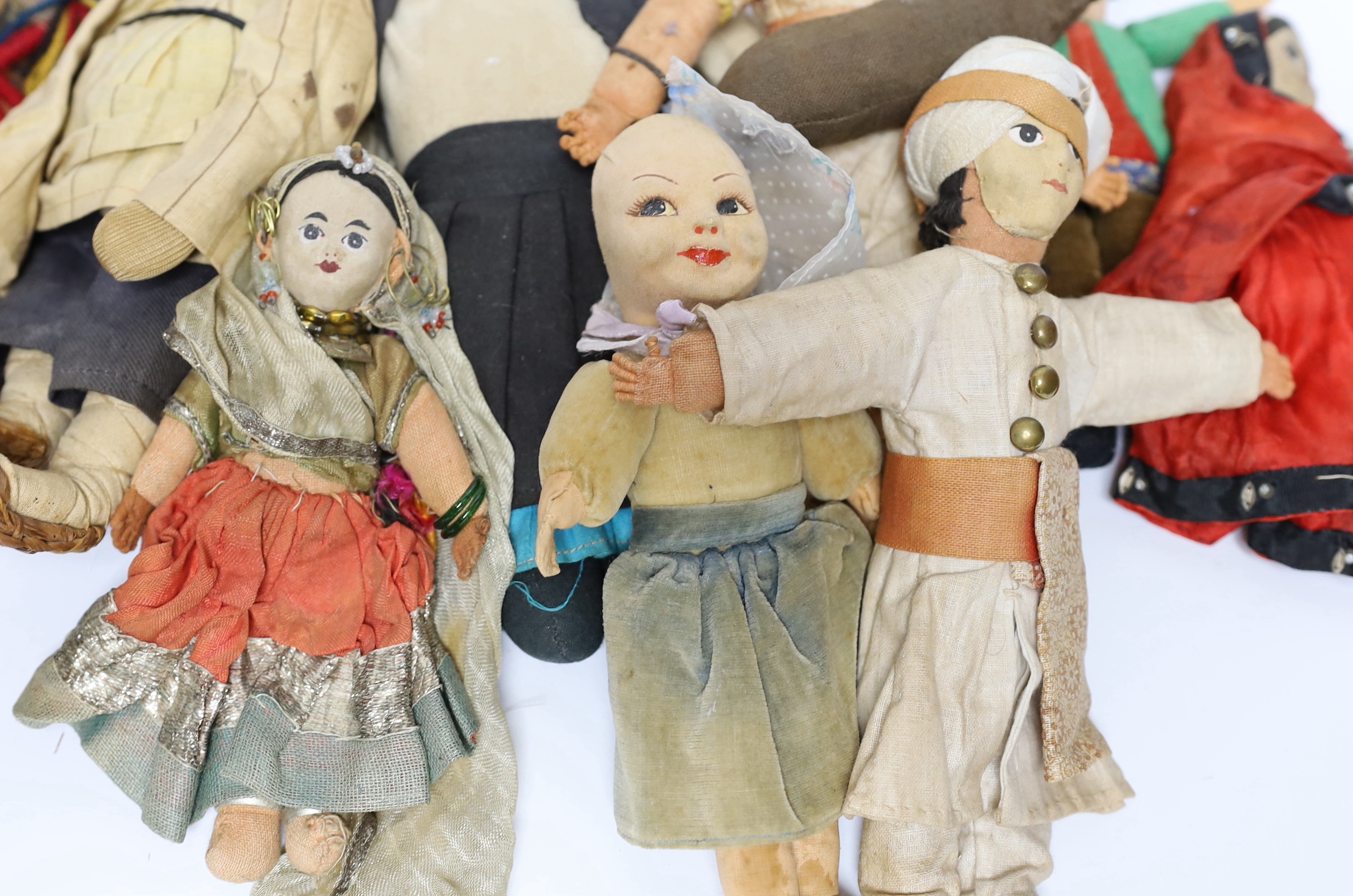 Nine dolls in European and Asian costumes